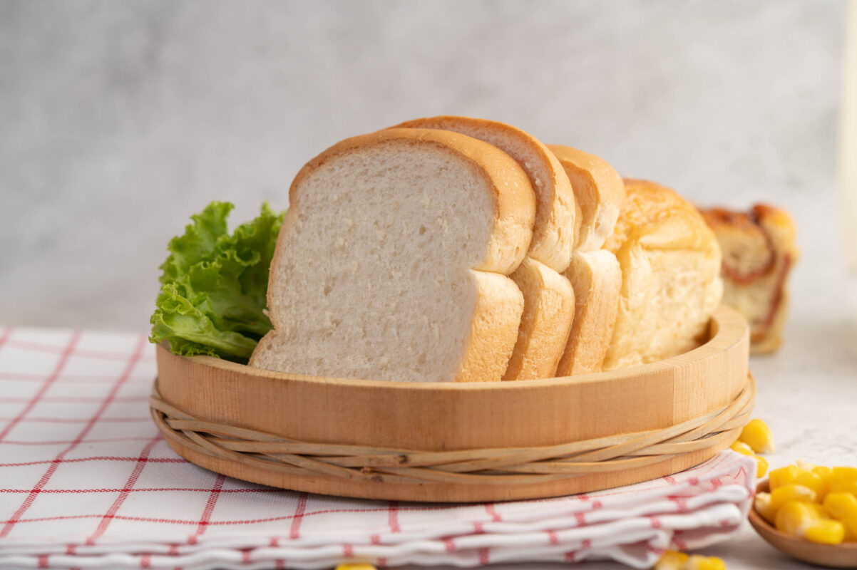 bread-wooden-tray-red-white-cloth-1202x800