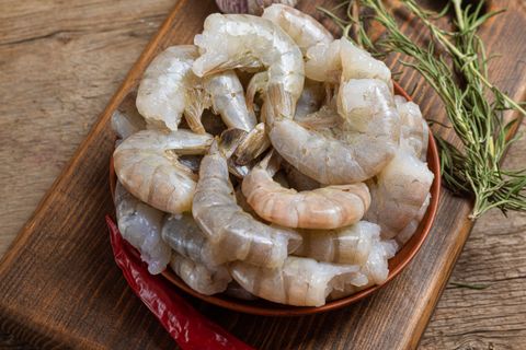 close-up-raw-shrimps-wooden-background (1)