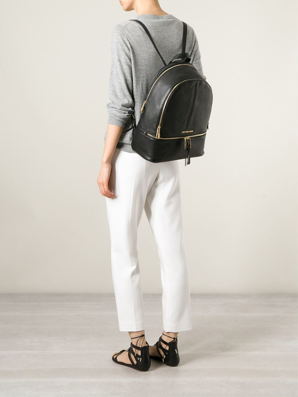 michael kors black and gold backpack