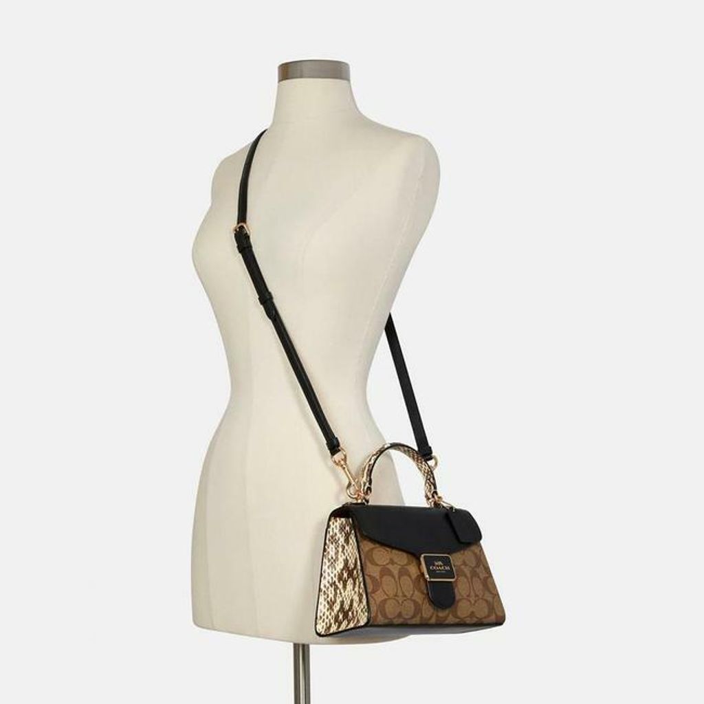 coach-pepper-satchel-in-signature-canvas-goldkhaki-black-leather-cross-body-bag-2-0-650-650.jpg