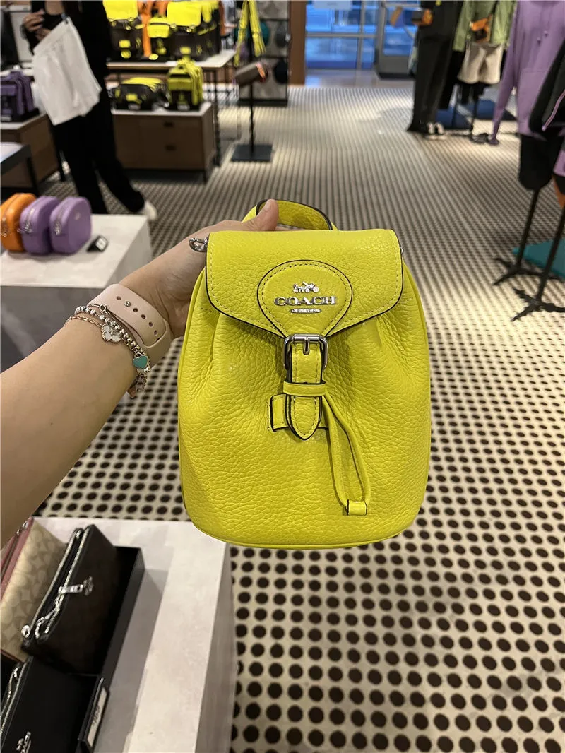 Coach on sale yellow backpack