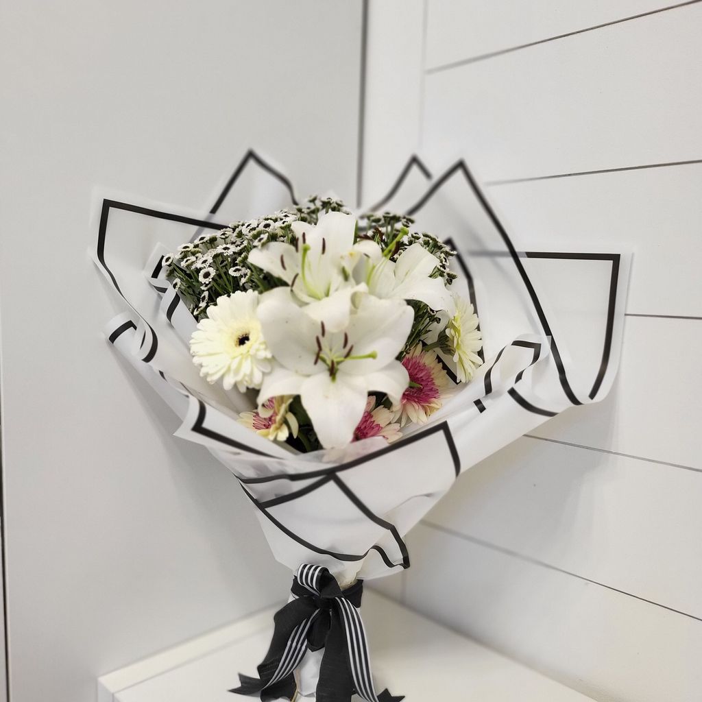 Charming White Lilies and Gerbera White With Black Eye Bunch