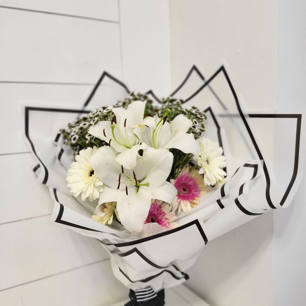 Charming White Lilies and Gerbera White With Black Eye Bunch