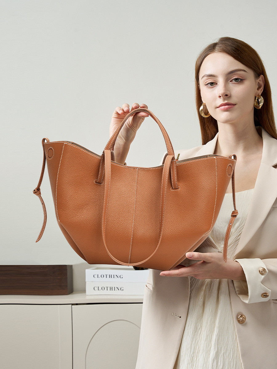 Model showcasing Urban Commuter Leather Tote Bag in Brown