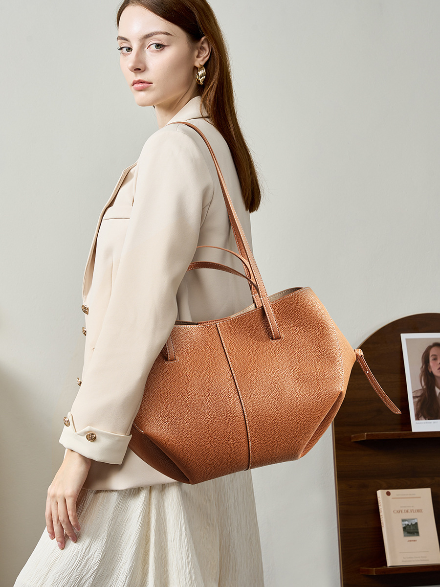 Model carrying Urban Commuter Leather Tote Bag in Brown – on shoulder style