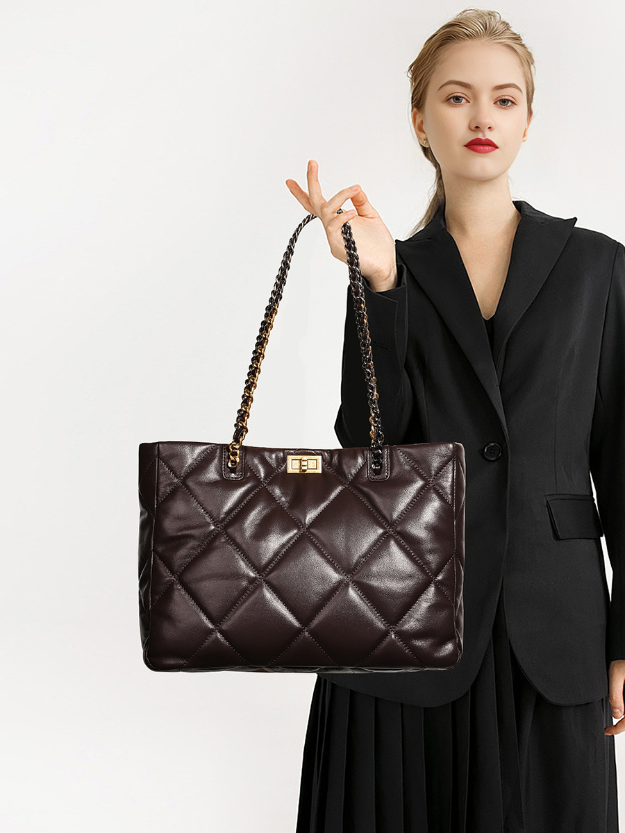 Model showcasing Elegant Quilted Leather Chain Tote Bag in Coffee