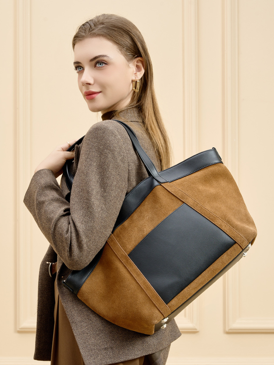 Model carrying Suede Leather Retro Tote Bag in Caramel