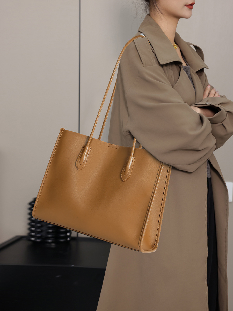 Model showcasing Premium Structured Leather Tote Bag in Golden Brown