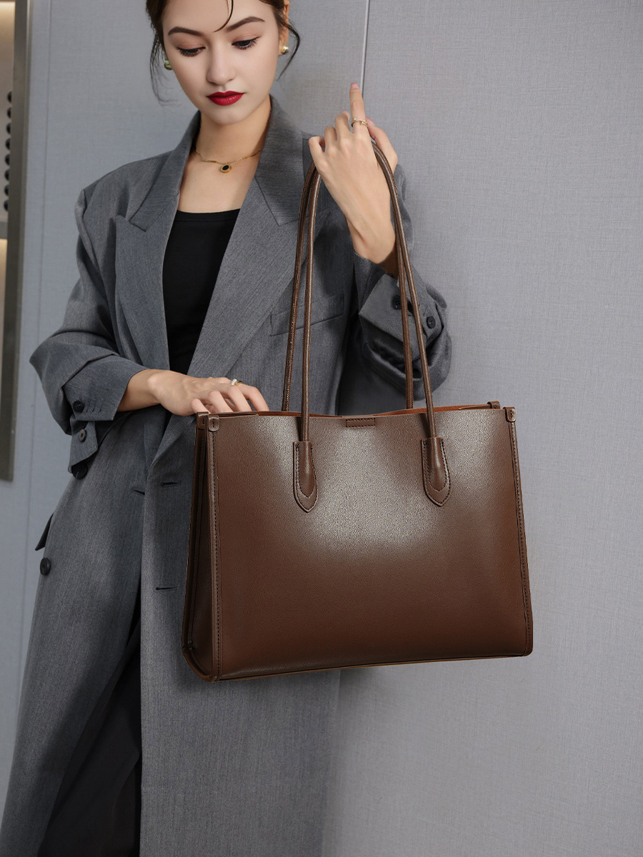 Model showcasing Premium Structured Leather Tote Bag in Coffee