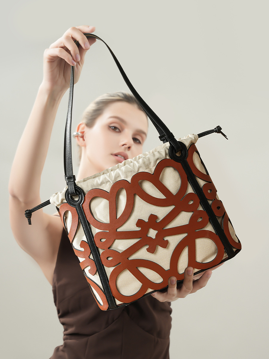 Model showcasing Premium Leather Cut-Out Tote Bag in Brown