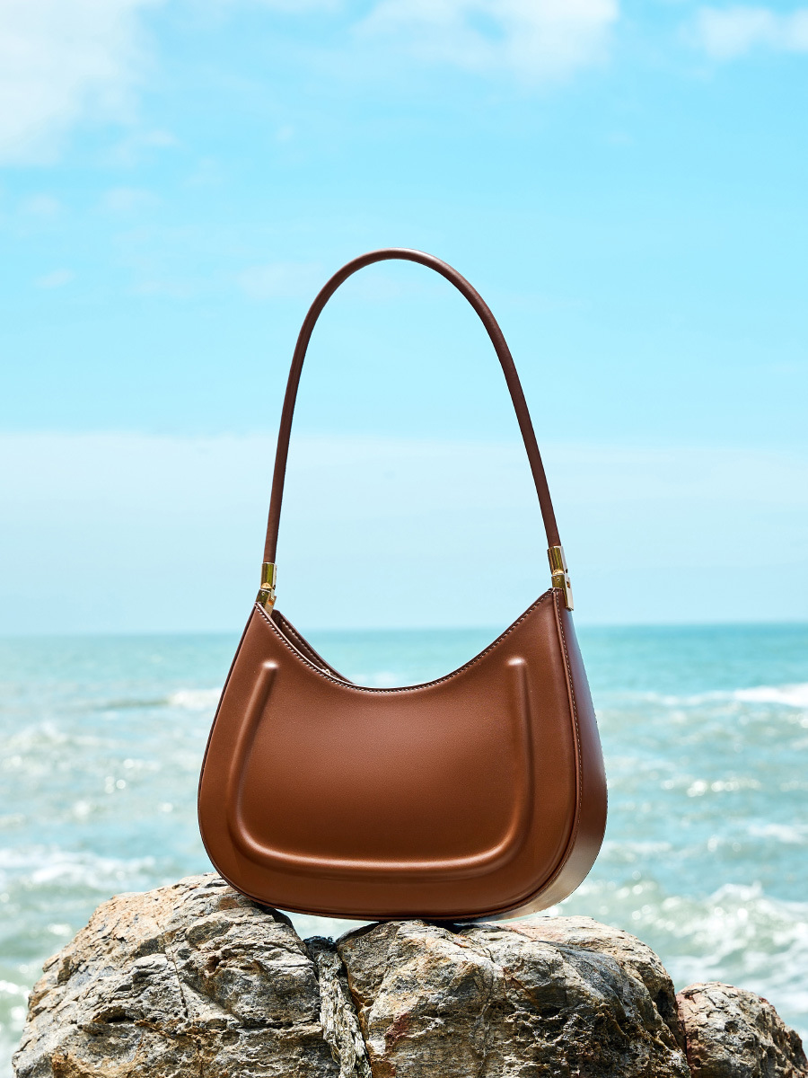 Oil Waxed Leather Minimalist Half Moon Bag in Caramel – Lifestyle Shot