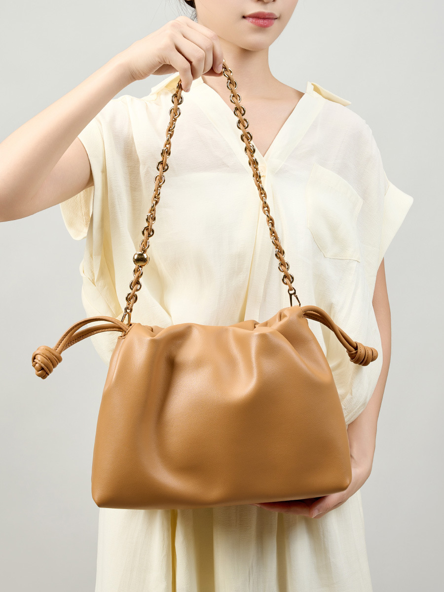 Model showcasing Elegant Genuine Leather Cloud Bag in Brown