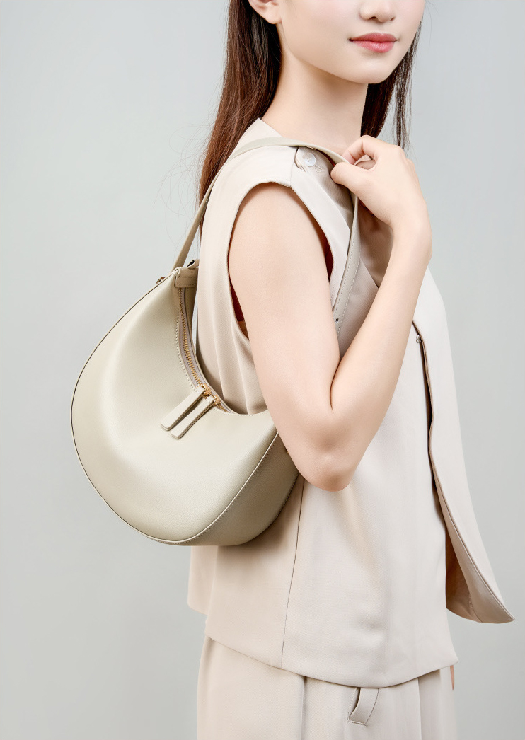 Model showcasing Refined Luna Genuine Leather Half Moon Bag in Off-White