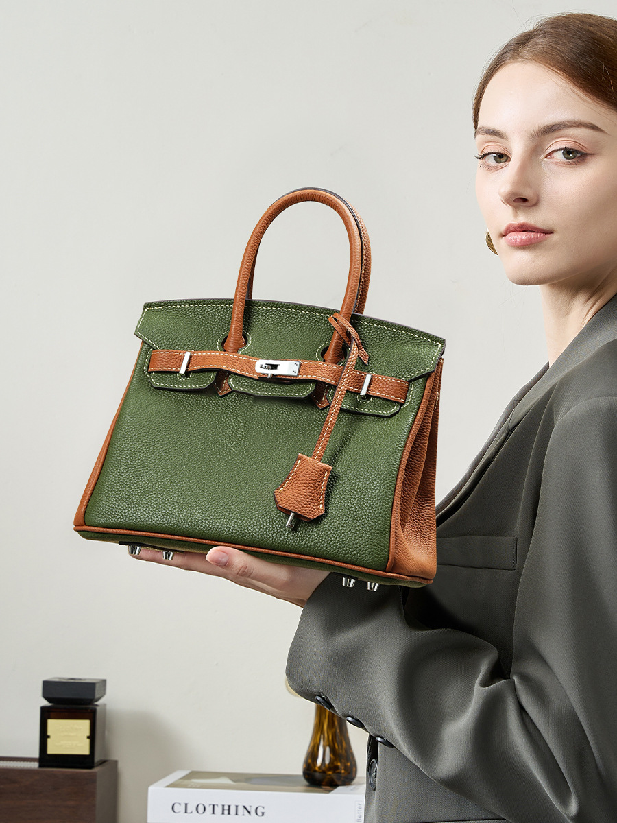Model with Premium Togo Leather Structured Two-Tone Top Handle Bag