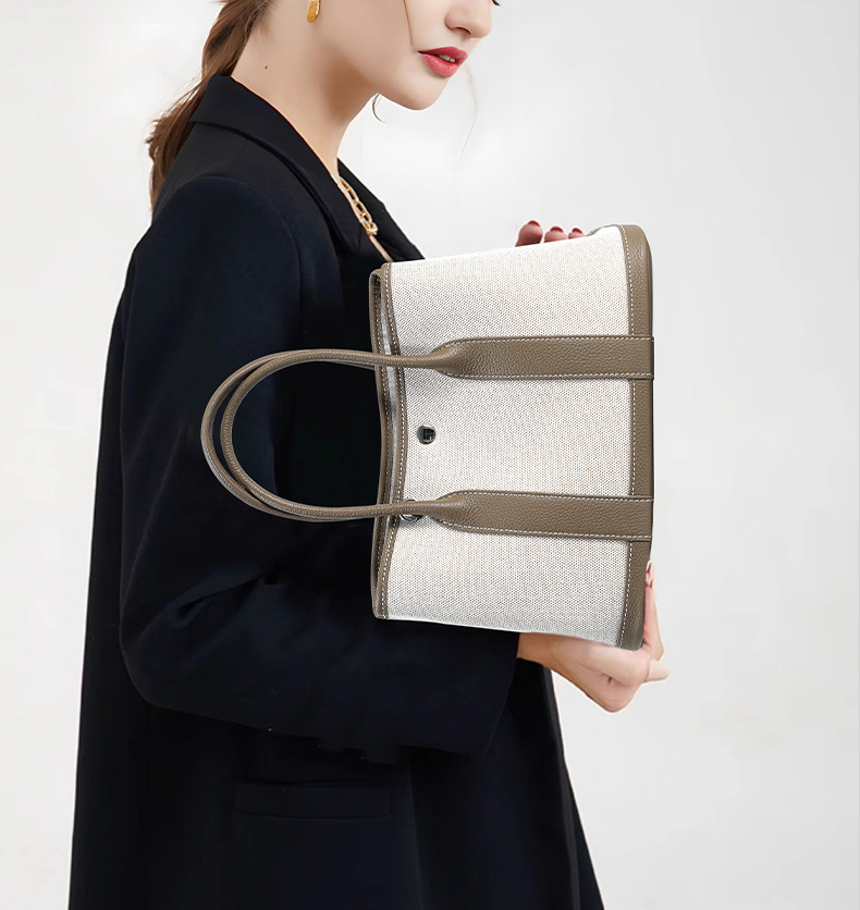 Model featuring Premium Genuine Leather and Canvas Structured Tote Bag in Khaki