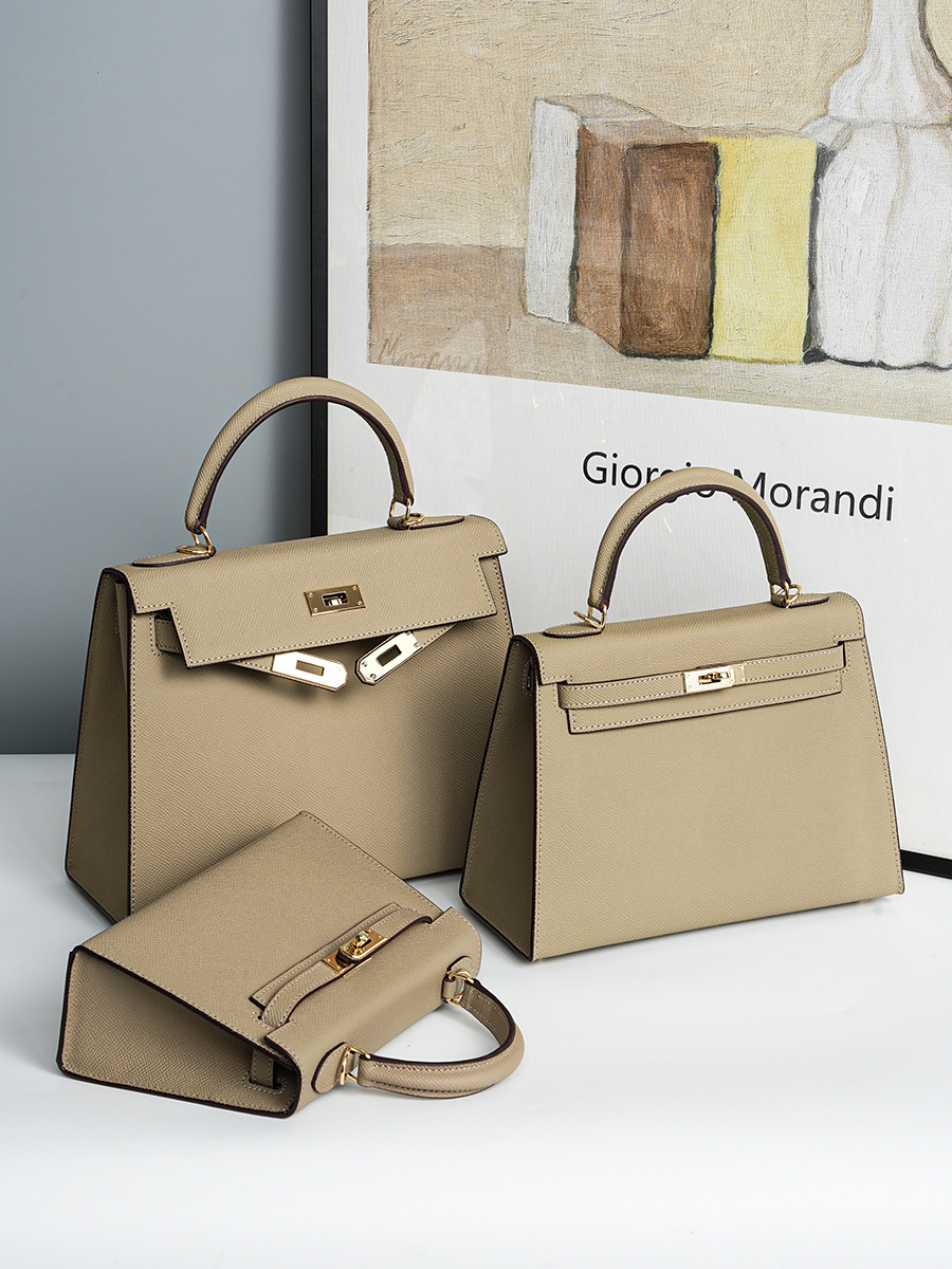 Lifestyle shot of Premium Genuine Leather Structured Top Handle Bags in Elephant Gray, shown in three different sizes