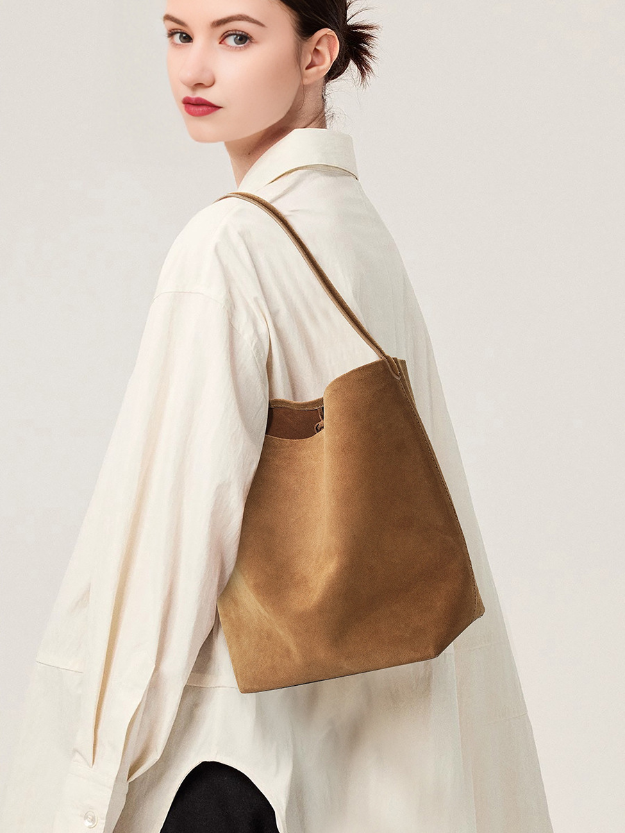 Model showcasing the Refined Suede Leather Bucket Tote Bag in Caramel (Small Size)