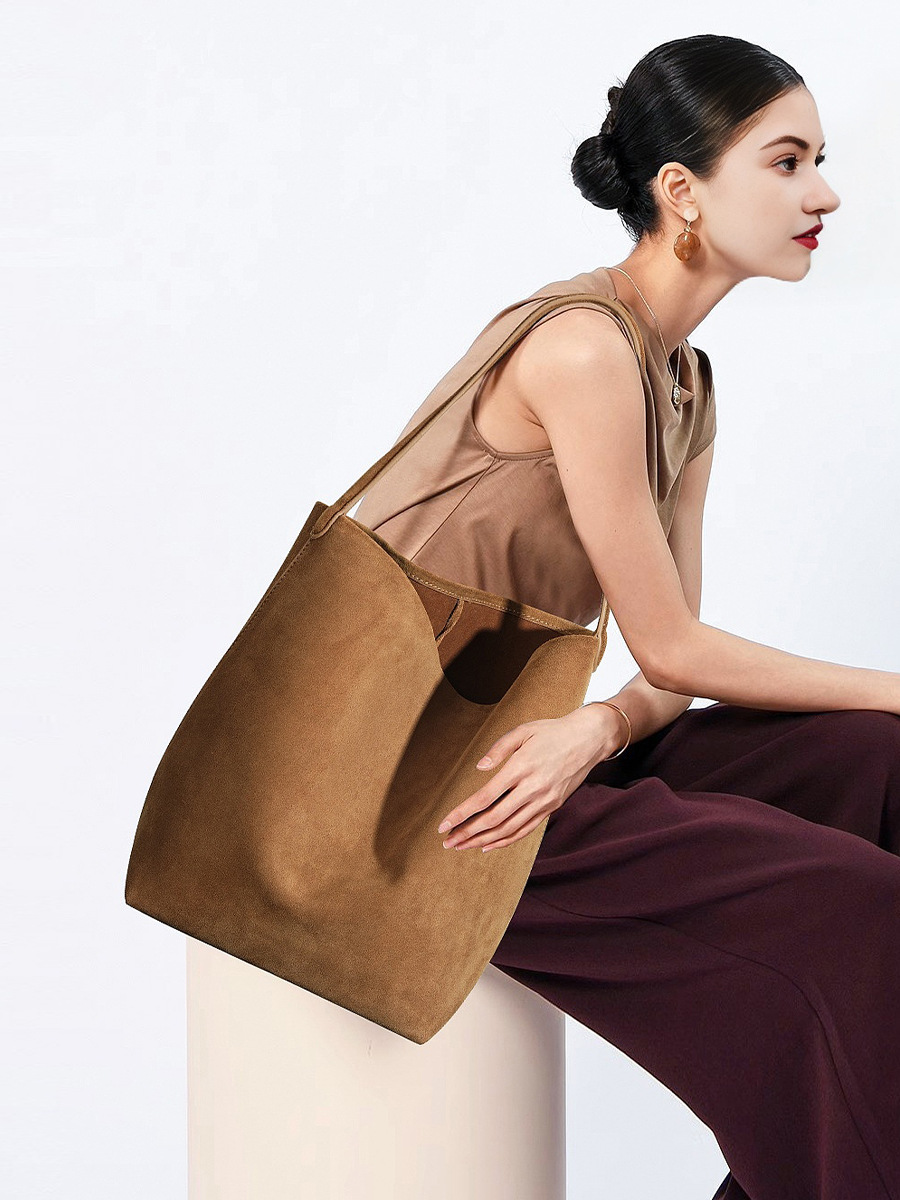 Model showcasing the Refined Suede Leather Bucket Tote Bag in Caramel (Large Size)