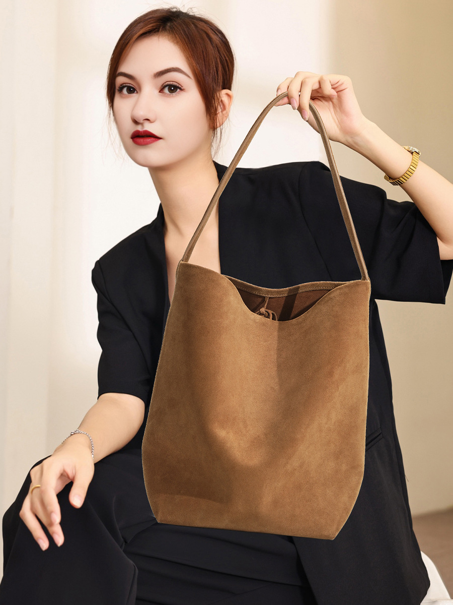 Model showcasing the Refined Suede Leather Bucket Tote Bag in Caramel (Large Size)