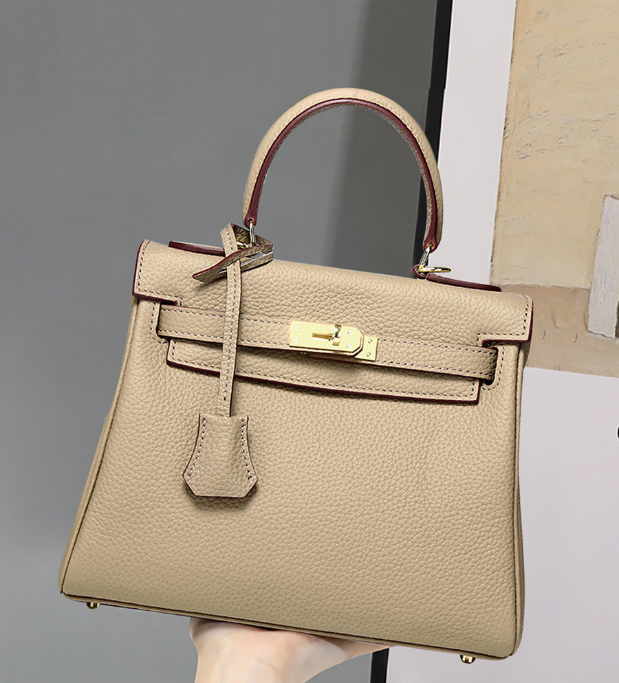 Model showcasing Premium Togo Leather Structured Top Handle Bag in Elephant Gray