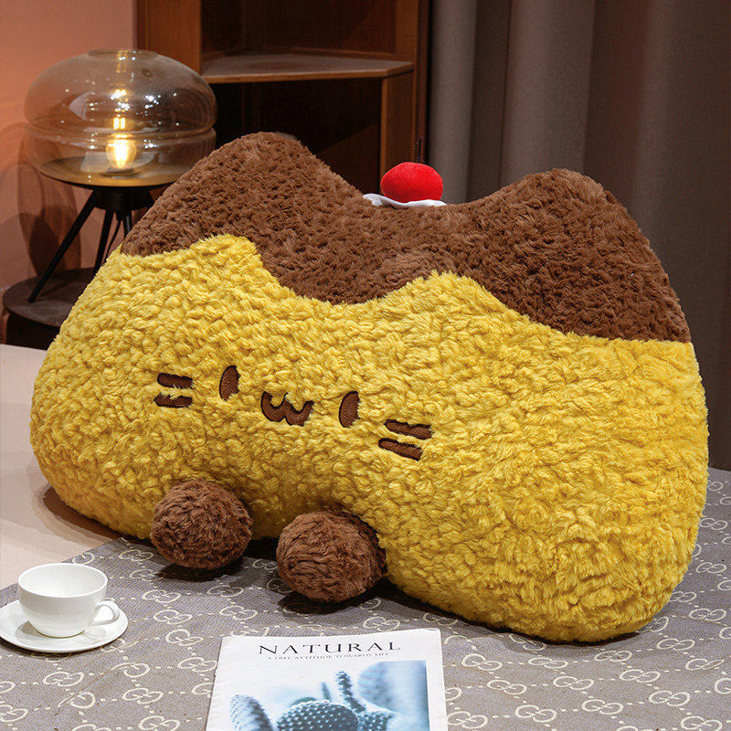 Pudding cat plush backrest pillow on a bed, fluffy pudding cat cushion providing soft back support for relaxing, reading, or cozy bedroom decor