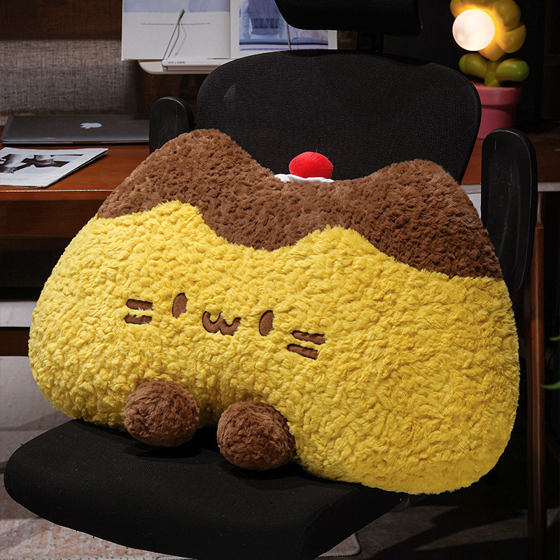 Pudding cat plush backrest pillow used as a soft cushion on a chair, fluffy pudding cat pillow providing comfortable back support for relaxing or working