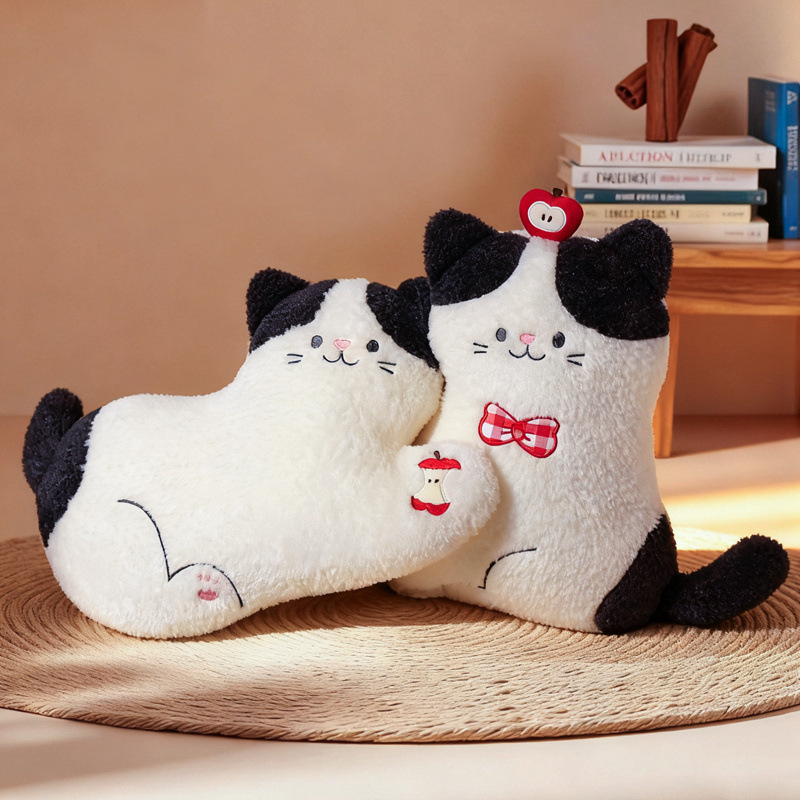 Apple cat plush pillows in lying and sitting styles with apple details, soft cat cushions displayed together as cozy home decor on a woven mat