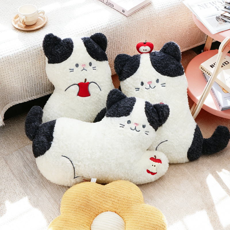 Apple cat plush pillow collection featuring lying, sitting and on back styles, soft plush cat cushions with apple details in a cozy home decor scene