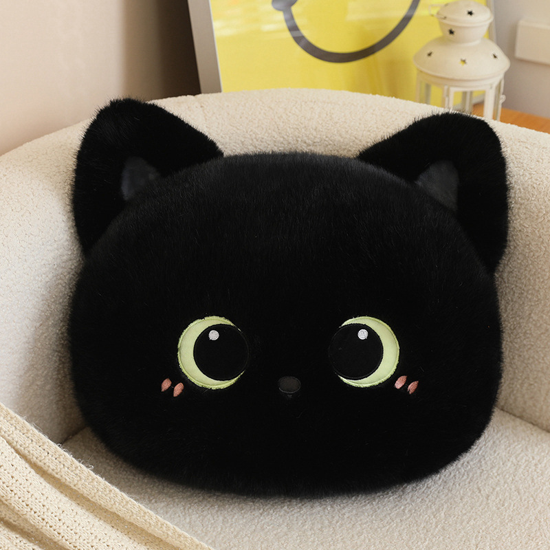 Black cat head plush pillow with ultra soft plush fabric and round fluffy shape, a cute cat face cushion perfect for relaxing and decorating home spaces