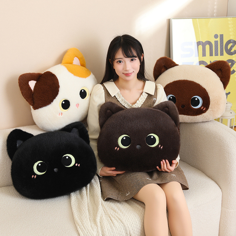 Cute cat head plush pillows in multiple colors on a cozy sofa, soft round cushions with big eyes designed for hugging, relaxing, and decorating beds or living room spaces