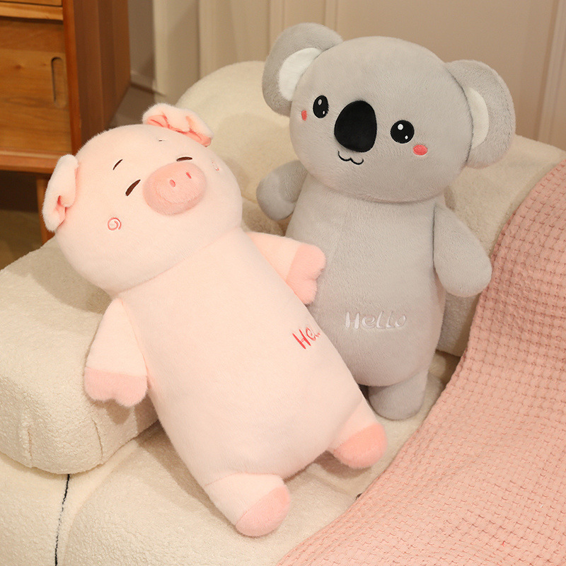 Cute chubby animal plush toys featuring pig and koala designs resting on a sofa, soft stuffed animals perfect for hugging and cozy home decor