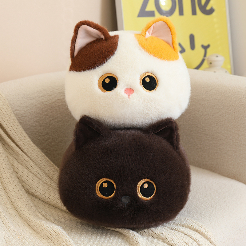 Bread cat plush pillows in calico and brown styles stacked on a sofa, soft round loaf-cat cushions with cute cat faces for hugging and cozy decor