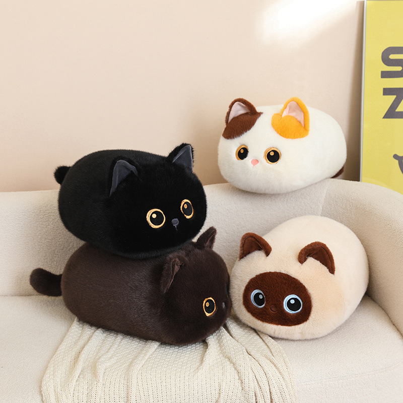 Four bread cat plush pillow styles including calico, siamese, brown and black cats, fluffy round loaf-cat cushions styled on a sofa for cozy relaxing decor