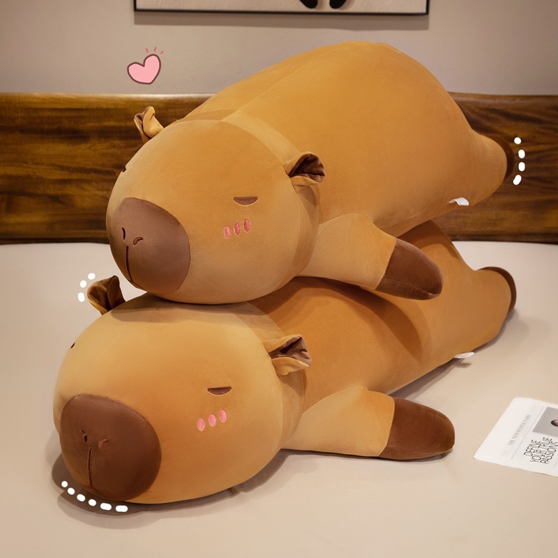 Stacked capybara plush pillows with a long, cushioned design, perfect for cozy lounging, hugging, and adding warmth to any space