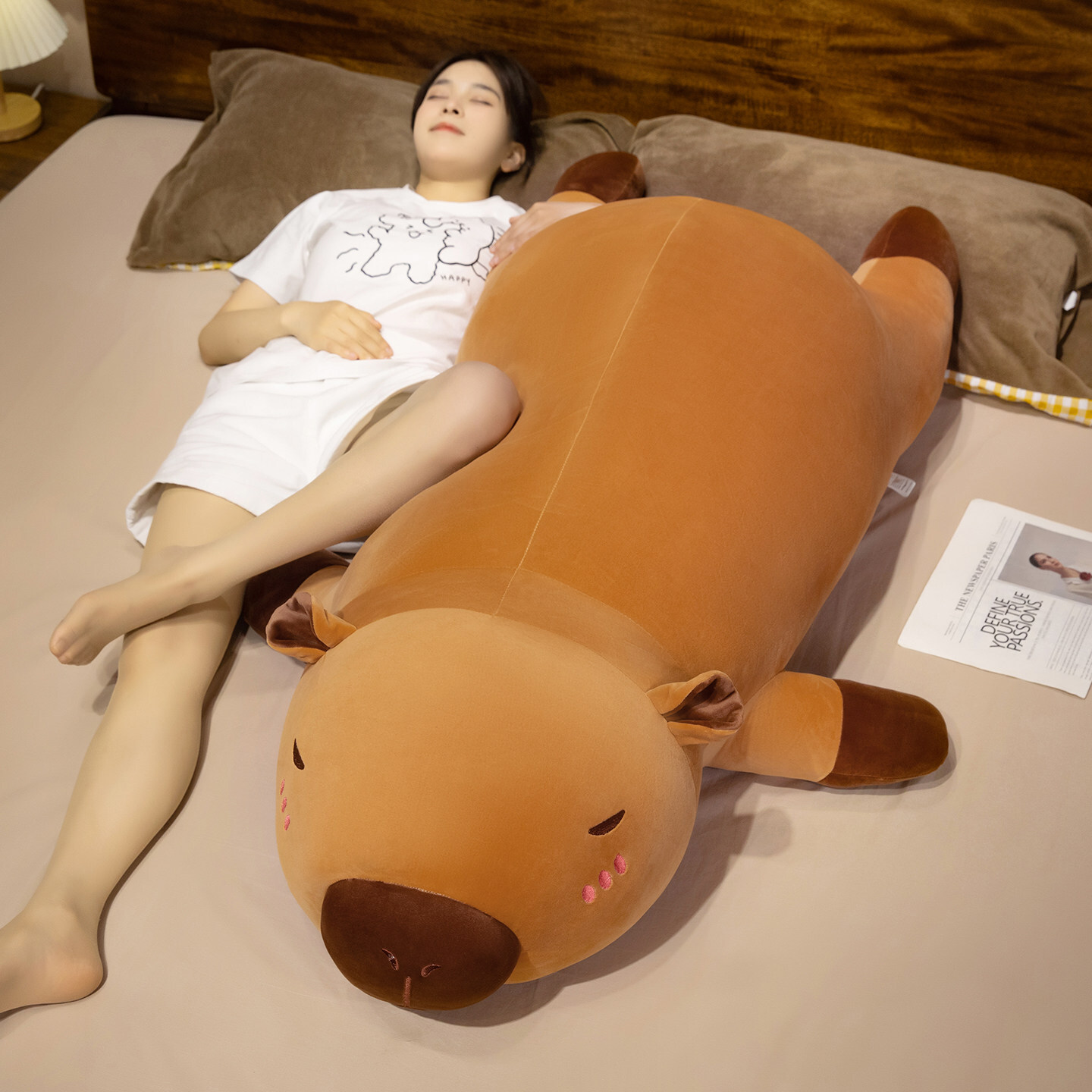 Capybara plush pillow as a long body pillow for sleeping, offering full-body support and a soft, cozy resting experience