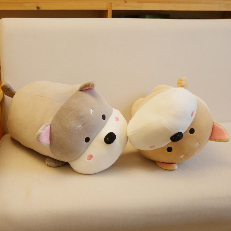 Lying dog plush pillows in gray and khaki placed on a sofa, soft and cuddly cushions perfect for resting, decorating, and everyday comfort