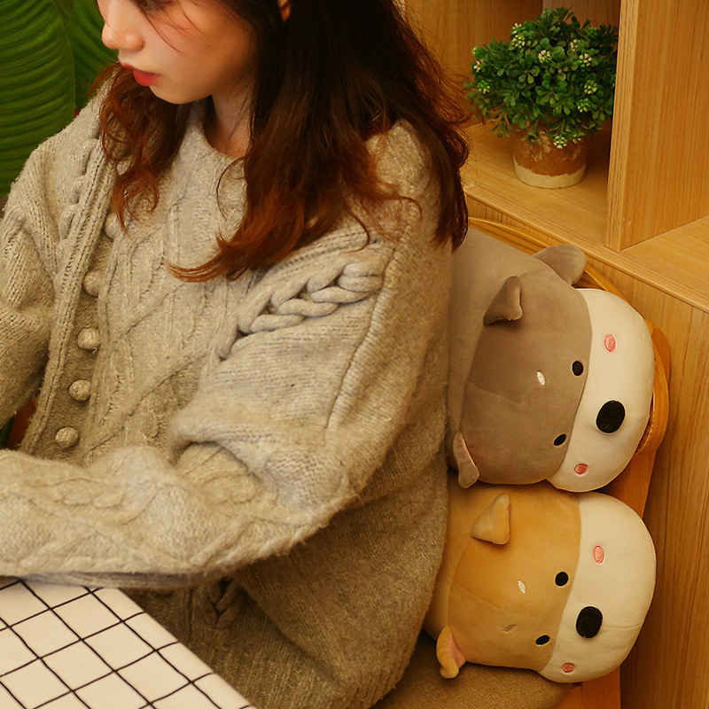 Lying dog plush pillows placed on a chair as soft back cushions, cozy and supportive for relaxing, reading, or everyday comfort at home