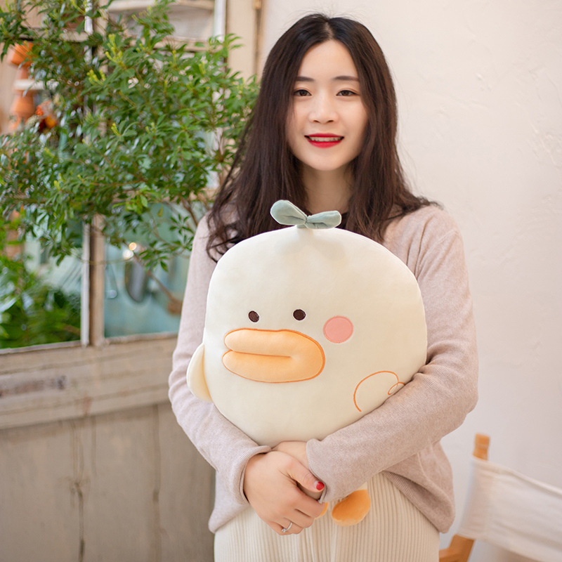 Duck plush pillow used as a soft hugging cushion, comfortable for lounging, napping, and everyday home comfort