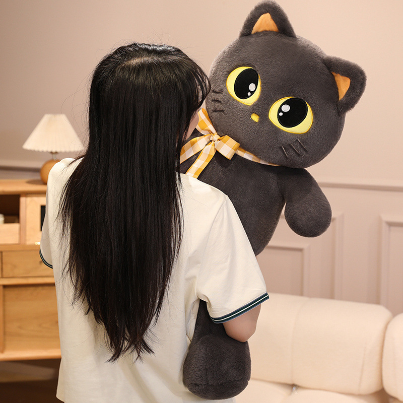 Cat plush toy with ribbon detail being hugged, soft stuffed animal for comfort, relaxation, and cozy home use
