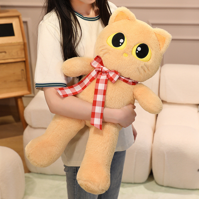 Light brown cat plush toy with ribbon detail, soft stuffed animal for hugging, relaxing, and comfortable everyday use
