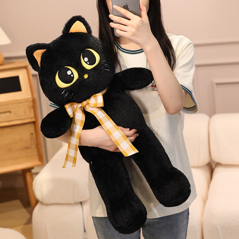 Black cat plush toy with ribbon detail, soft stuffed animal for hugging, relaxing, and cozy everyday comfort