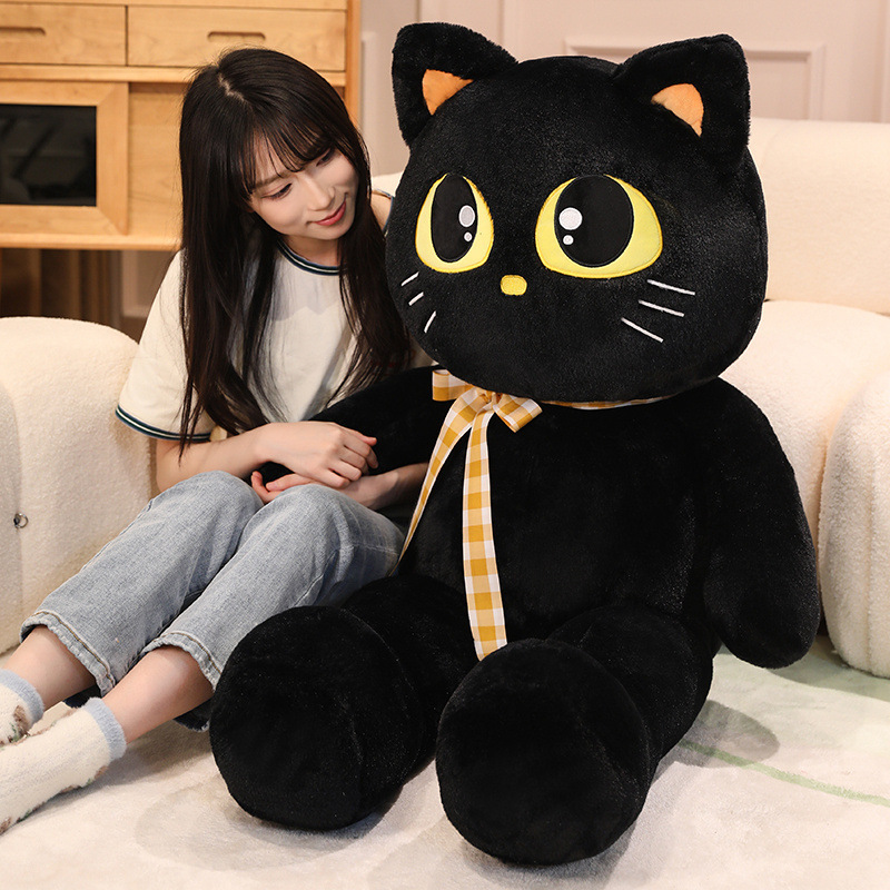 Cat plush toy with big eyes and ribbon, soft huggable stuffed animal perfect for relaxing, lounging, and cozy home use