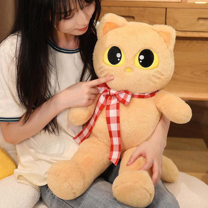 Light brown cat plush toy with ribbon detail, soft stuffed animal with cute face, ideal for cuddling and cozy relaxation