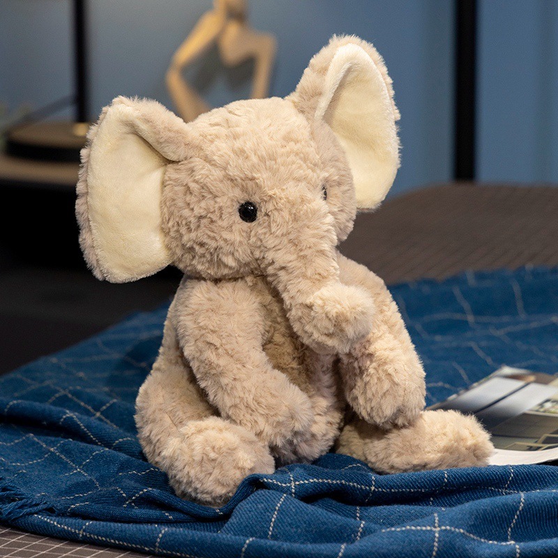 Elephant plush toy with plush fabric and PP cotton filling, ideal for hugging and adding comfort to beds and cozy spaces