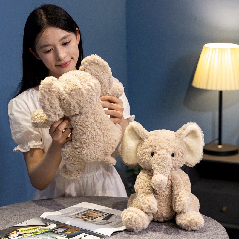 Soft elephant plush toy shown as a cuddly companion for relaxation, ideal for hugging and adding warmth to cozy indoor spaces