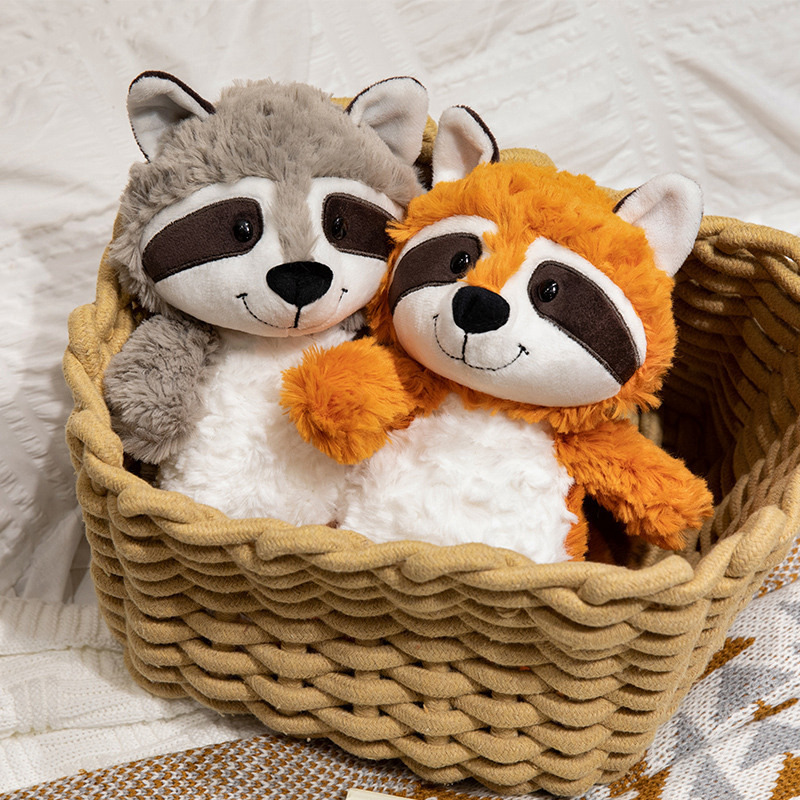 Gray and orange raccoon plush toys soft cuddly stuffed animals in woven basket for cozy home decor