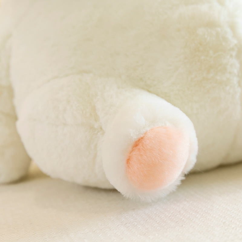 Rabbit plush toy paw detail with soft plush fabric and peach-colored foot pad, showing fine texture and cozy feel for hugging and everyday comfort