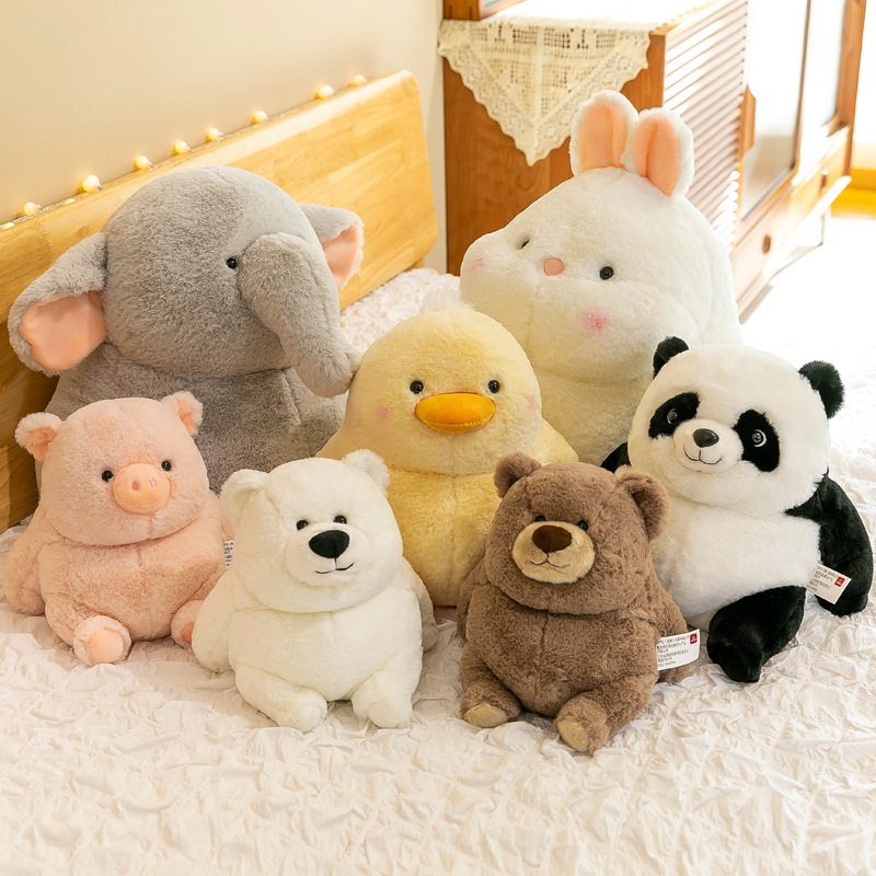 Chubby animal plush toys featuring elephant, rabbit, duck, panda and bear arranged on bed, soft cuddly companions perfect for bedtime comfort and cozy home styling