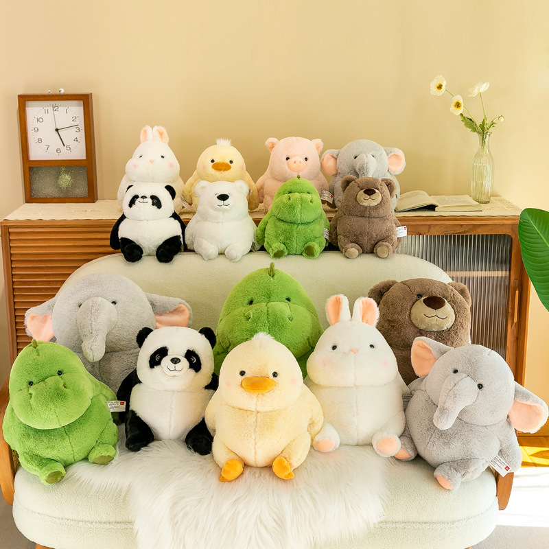 Chubby animal plush toys including panda, duck, elephant, rabbit and dinosaur displayed on sofa in a cozy home setting, soft and cuddly decorative plush for relaxing spaces