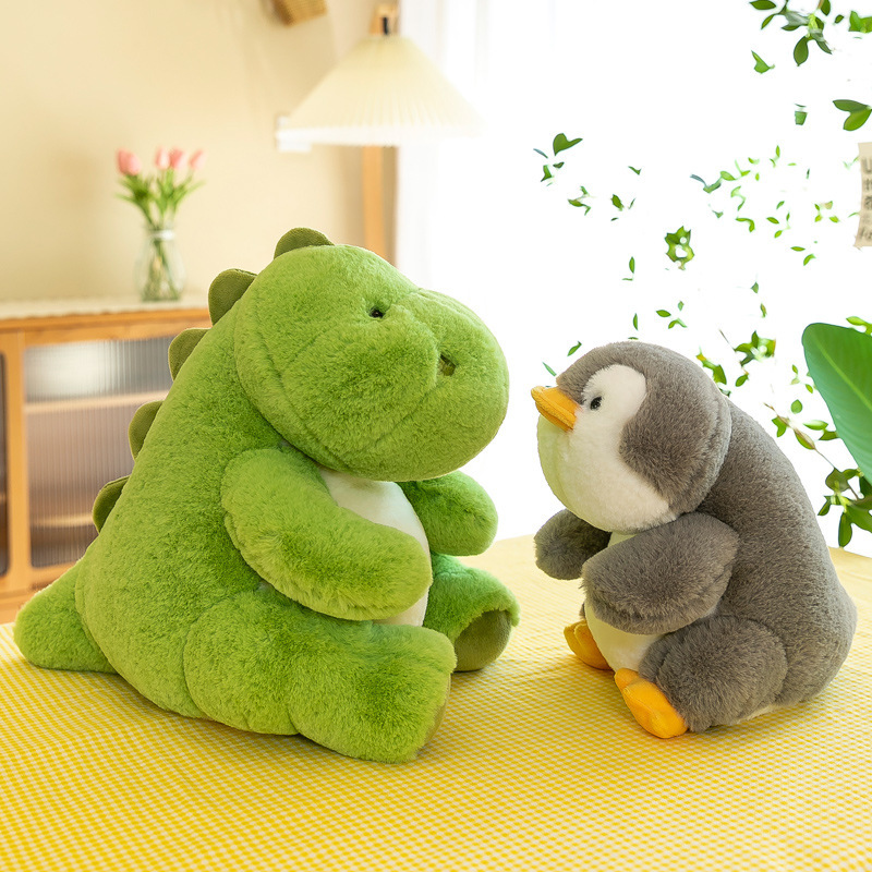 Dinosaur and penguin companion plush toys in a cozy setting with soft plush material, ideal for relaxing and everyday companionship